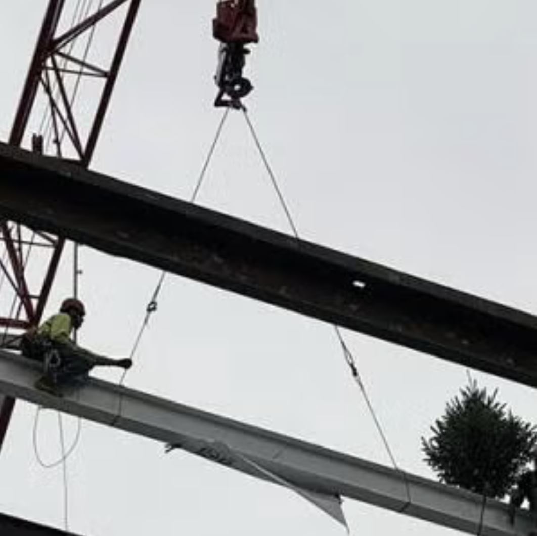 The final beam of the ISEB is lowered into place