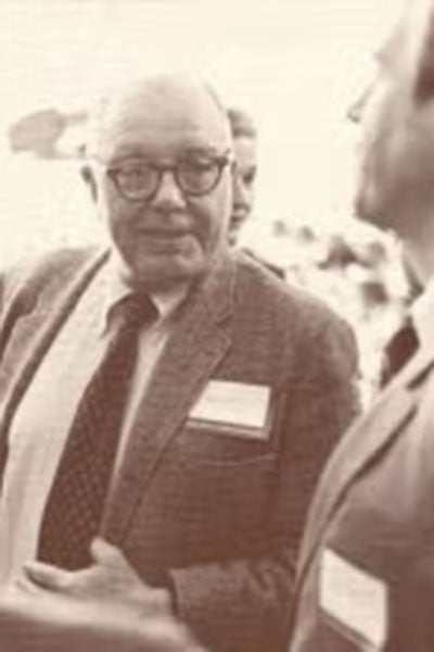 Jack Caughey speaking to someone at an event