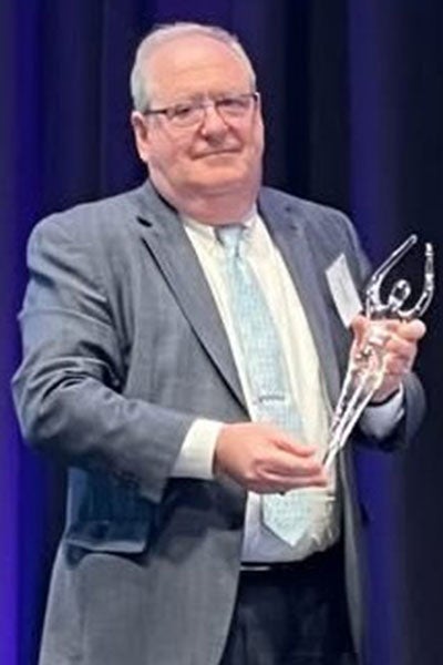 Alex Wallach receiving an award