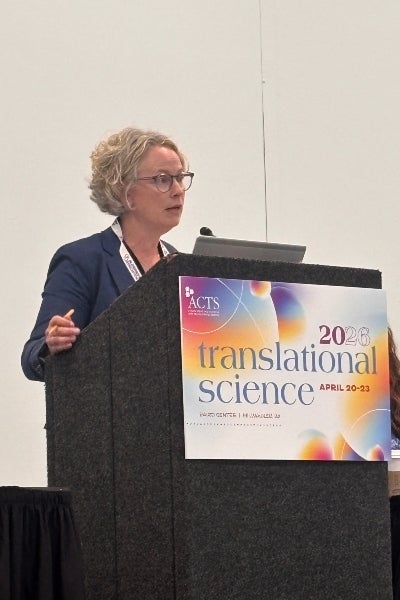 Woman standing at a podium