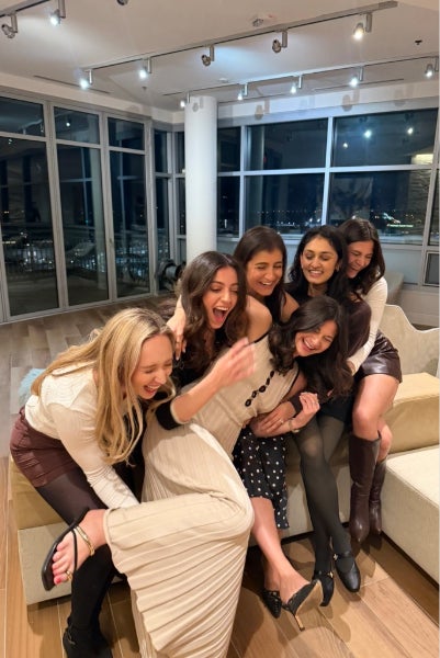 Samantha and Allison Epstein laughing with friends
