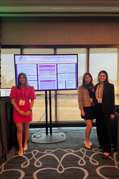 Samantha and Allison Epstein presenting a poster