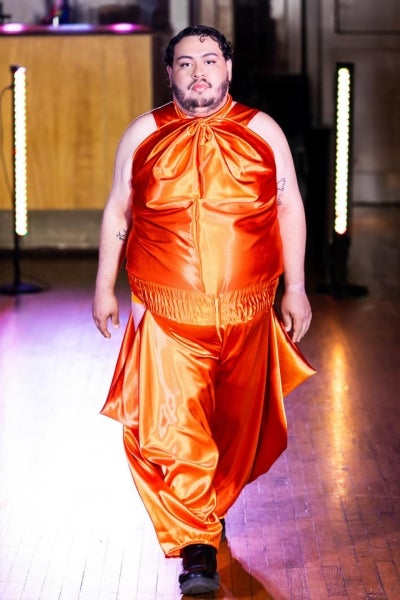Omie Meza walks the runway at the Summerfest fashion show, hosted by Haus of Transcendent.  