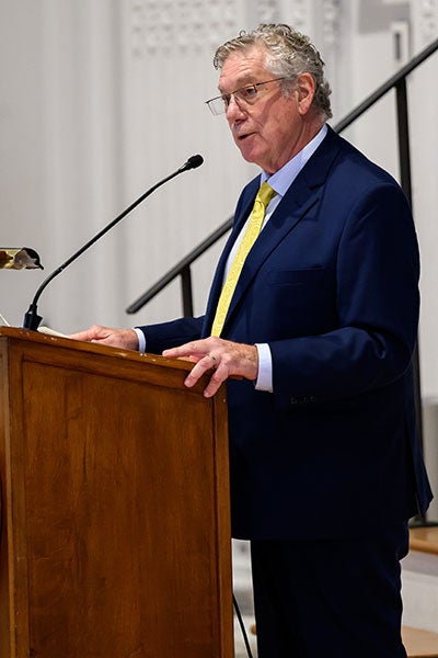 Steve Kaufman speaking at a lectern at an event in October