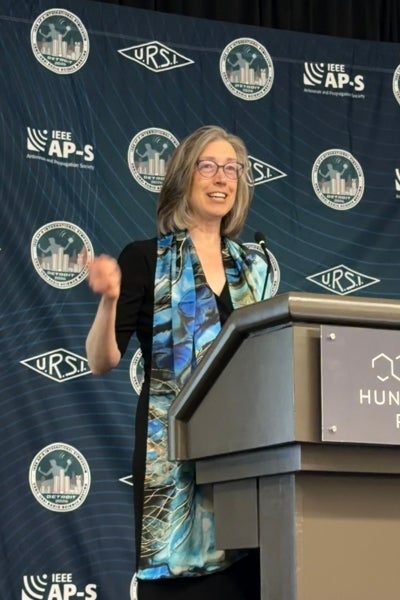 Susan Hagness speaks at a podium