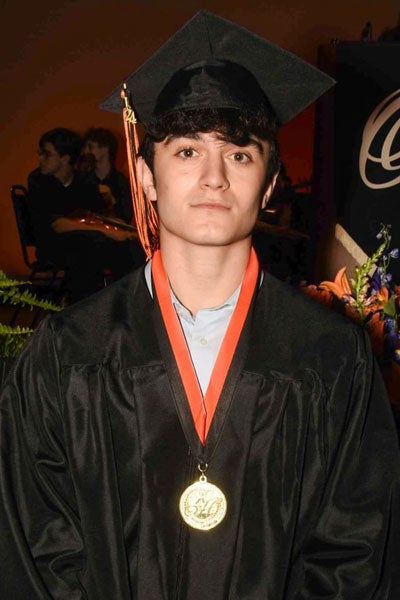 Photo of Alex Khouli in a graduation cap and gown