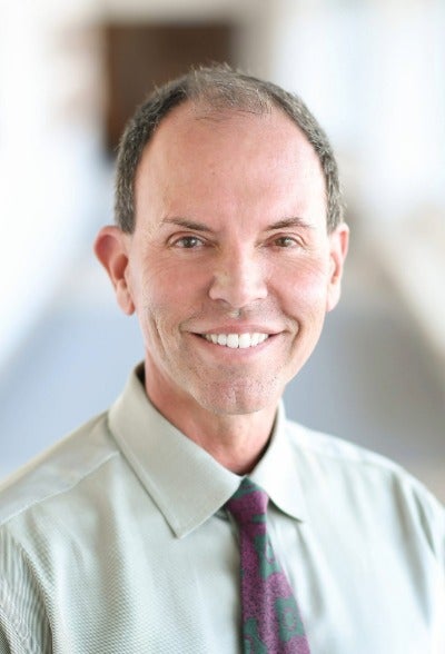 Man wearing a tie against a blurred background
