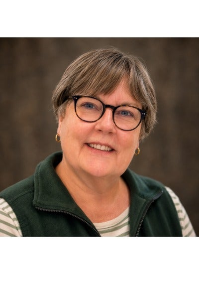 Woman wearing green sweater smiling