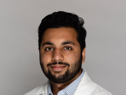 Muhammad Haroon in lab coat
