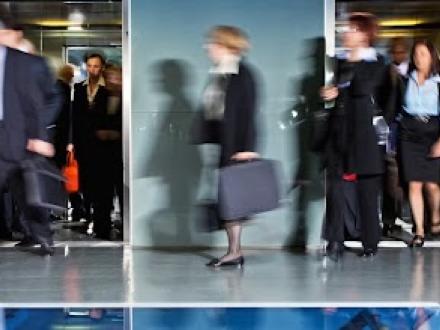 Business people walking through office.
