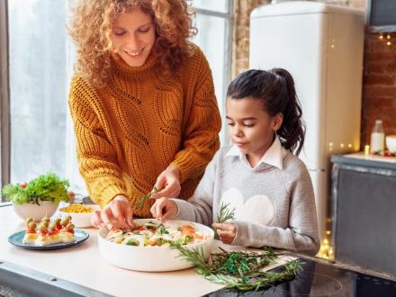 Woman and child making a salad