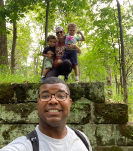 Brock Montgomery hiking with his wife and two children