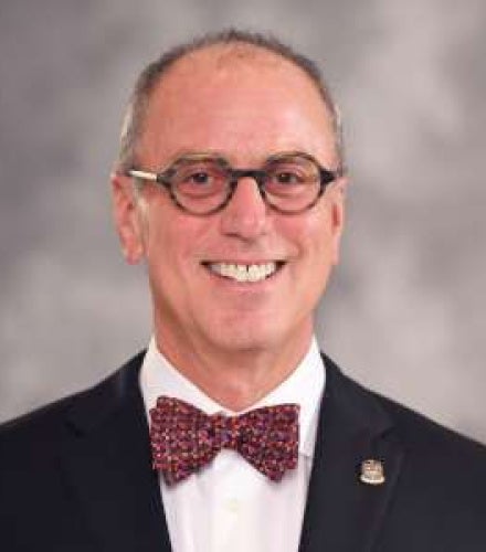 Martin Eichner wearing a bow tie and smiling 