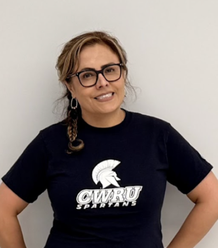 Edith Cabrera poses in a blue Spartans t-shirt