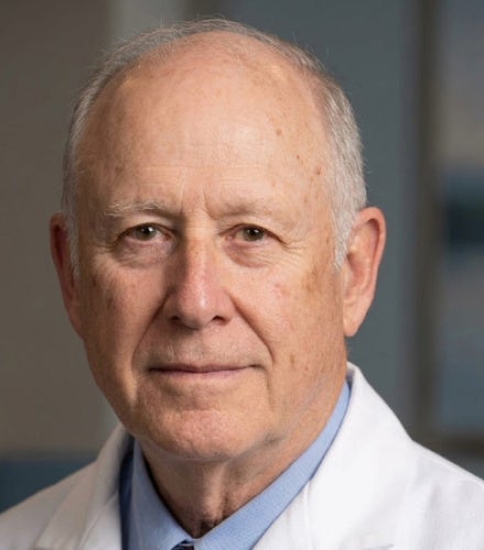 Headshot of Dr. Landers wearing a white coat