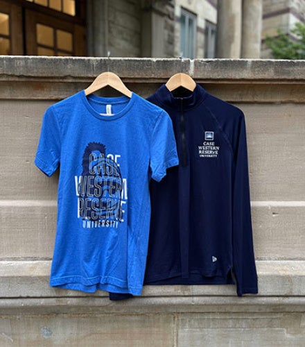 View of new t-shirt and quarter-zip for September 2026 Blue CWRU sale.