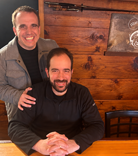 Photo of Adam Paulisick and John Pastor smiling