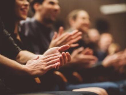 Several people clapping their hands