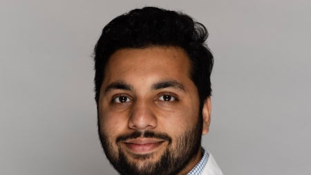 Muhammad Haroon in lab coat