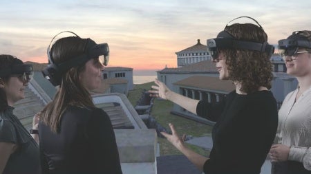 Maggie Popkin with students looking at Samothrace