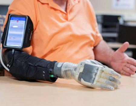 Photo showing a man using an advanced prosthesis