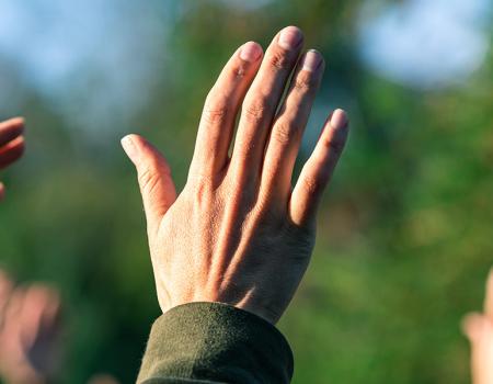 the hands of a religious group