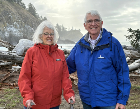 Ed and Melinda Sadar in the mountains wearing winter gear