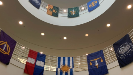 Image of a large stairway area with banners displayed across railings