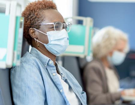 Photo of a patient with a healthcare professional during a cancer clinical trial