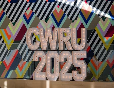 Photo of CWRU 2025 spelled out in marquee lights in Tinkham Veale University Center