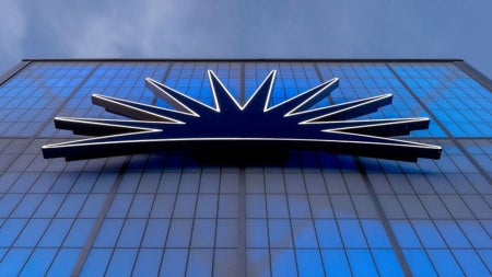 Photo of the light-up CWRU logo on the back of a campus building