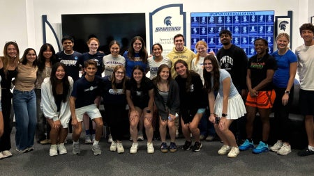 23 students in CWRU AIM posing and smiling together