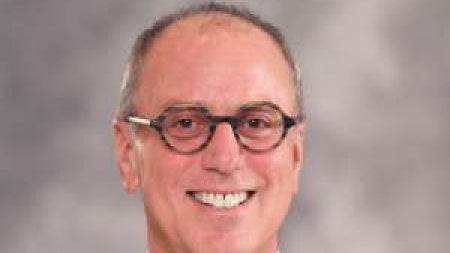 Martin Eichner wearing a bow tie and smiling 