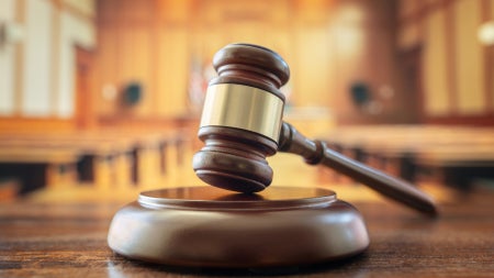 Judges gavel in court room legal trial and law background