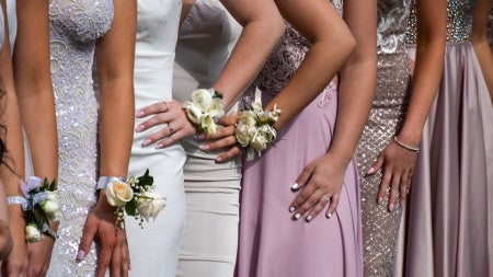 Close up of individuals in prom dresses