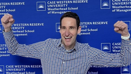 Reid Tileston celebrating after the successful defense of his thesis