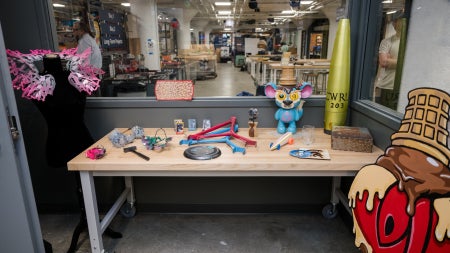 Various painted items on a table at the Sherwin-Williams Paint & Coatings Studio, located at Sears think[box]. 