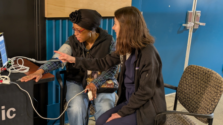 CWRU medical student takes the blood pressure of a community member at a CentroVilla25