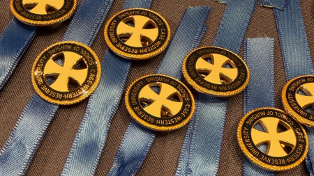 School of Nursing pins laid out on the table