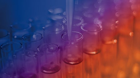 A series of glass test tubes under a pipette, with a gradient of blue to orange lighting, creating a scientific and innovative atmosphere.