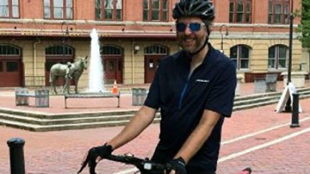 Rob Kollin on a bike on a brick street in Cumberland, Maryland.