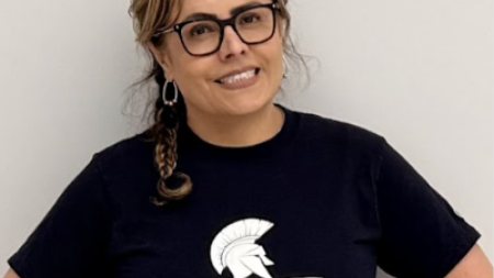 Edith Cabrera poses in a blue Spartans t-shirt