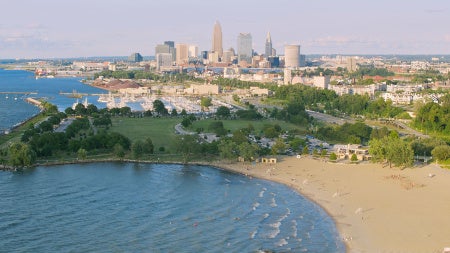 Aerial photo overlooking Edgewater Beach and the Cleveland skyline in the background
