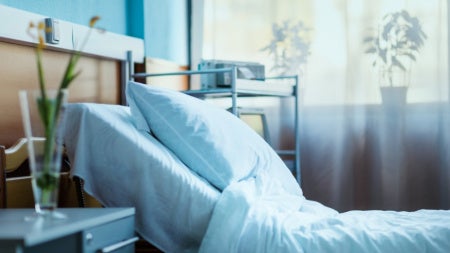Side view of an empty hospital bed