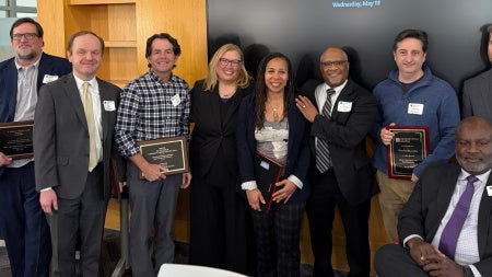 Group of law school faculty standing and posing for a photo