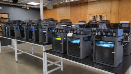 Fleet of high-speed Bambu X2C printers at Sears think[box]. 