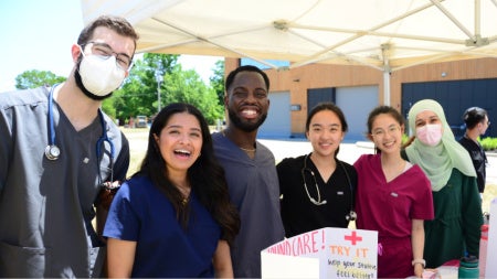 CWRU School of Medicine students staff the Teddy Bear Clinic at Case Comprehesnive Cancer Center’s Black Family Cancer Awareness event