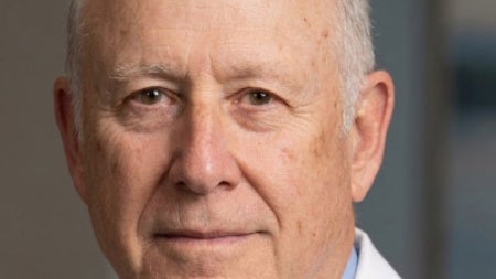 Headshot of Dr. Landers wearing a white coat