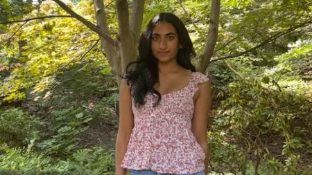 Photo of Ankita Achanta posing in a wooded area