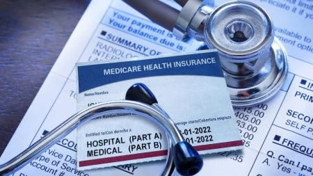 Close up of a stethoscope on Medicare insurance forms 